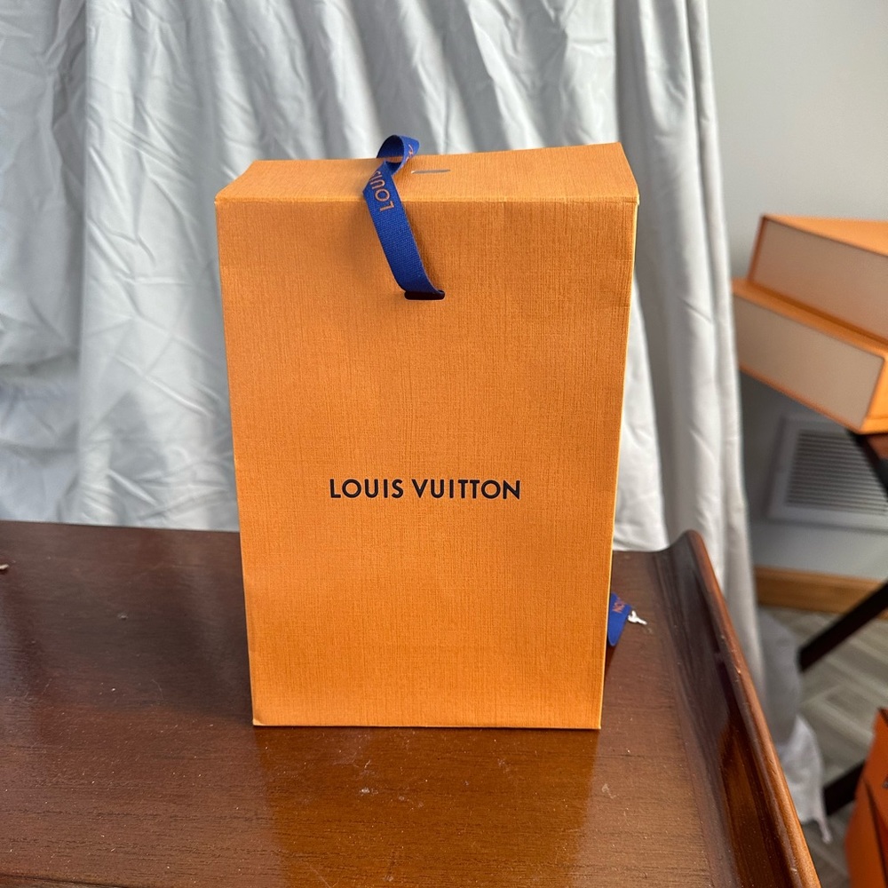 Louis Vuitton cologne bag.